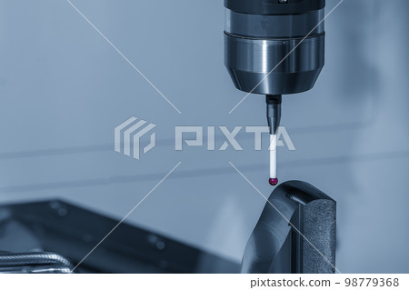 Close up scene the touching probe measuring the metal parts. Close up scene the touching probe measuring the metal parts. 98779368