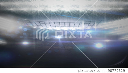 Image of neon soccer ball over sport stadium 98779829
