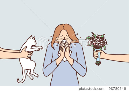 Woman sneezes or experiences rheum due to allergic reaction to cat or flowers 98780346