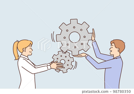 Man and woman move gears togethersymbolizing industrial business process Man and woman move gears togethersymbolizing industrial business process 98780350