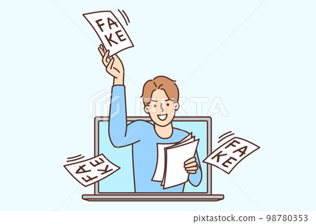 Man looks out of laptop screen scattering pieces of paper with inscription fake Man looks out of laptop screen scattering pieces of paper with inscription fake 98780353