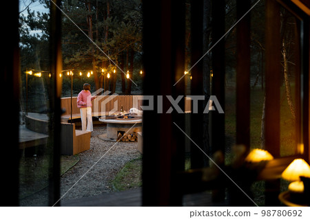 Beautiful lounge area near house in forest 98780692