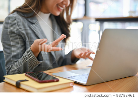 Asian businesswoman having an online meeting with her team. cropped image Asian businesswoman having an online meeting with her team. cropped image 98782461