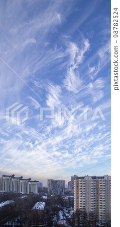 Residential area of Moscow on winter evening, against a beautiful sky with clouds, Russia 98782524