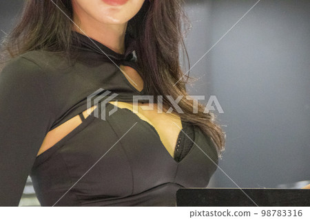 chest of a woman with big breasts chest of a woman with big breasts 98783316