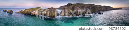 Aerial view of Ballintoy Harbour near Giants Causeway, County. Antrim, Northern Ireland, UK 98784802