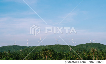 Windmills row Beautiful day time clear blue blue sky Vietnam green mountain tropical palm trees Natural landscape 98788020