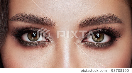 Female eye with long false eyelashes Female eye with long false eyelashes 98788190