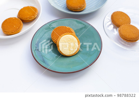 Custard cream sandwich biscuits on white background. Custard cream sandwich biscuits on white background. 98788322