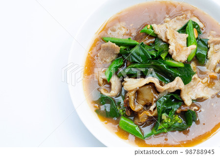 Fried flat noodle with pork and kale in gravy sauce Fried flat noodle with pork and kale in gravy sauce 98788945