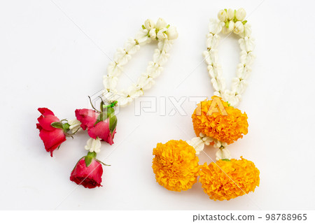 Jasmine and crown flower garland with rose and marigold flower on white background Jasmine and crown flower garland with rose and marigold flower on white background 98788965