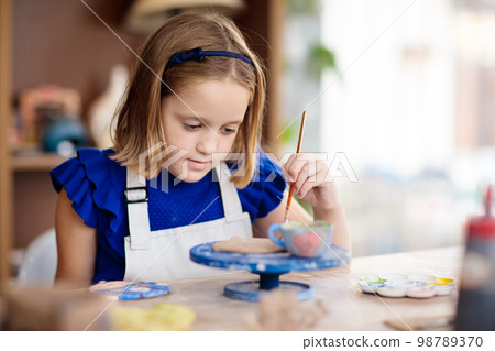 Child at pottery wheel. Kids arts and crafts class 98789370