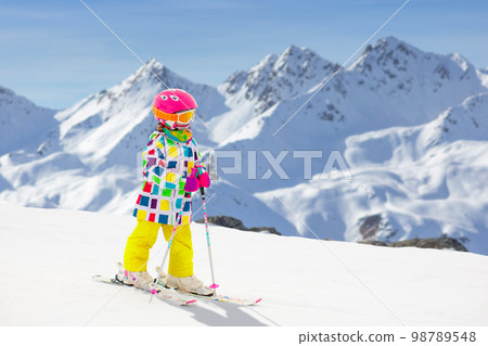Ski and snow fun. Child in winter mountains. Ski and snow fun. Child in winter mountains. 98789548