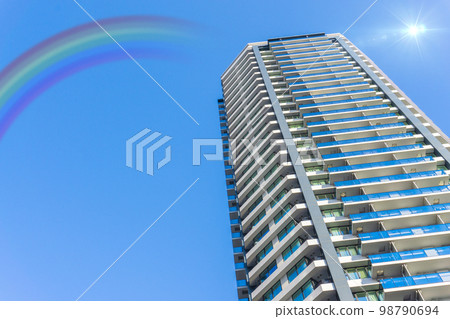 Skyscrapers and blue sky with rainbow after rain Skyscrapers and blue sky with rainbow after rain 98790694