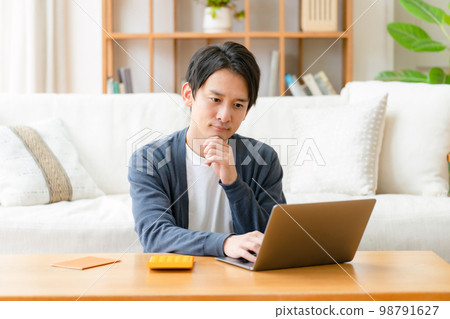 Worried man calculator life plan Worried man calculator life plan 98791627