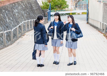 High school student going to school with friends High school student going to school with friends 98792466