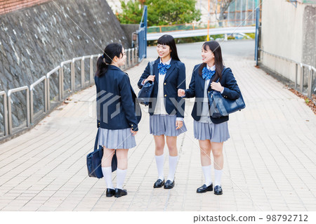 High school student going to school with friends High school student going to school with friends 98792712