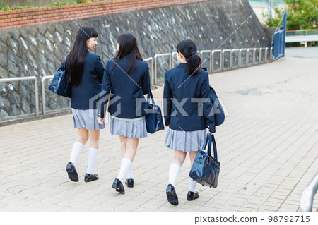 High school student going to school with friends High school student going to school with friends 98792715