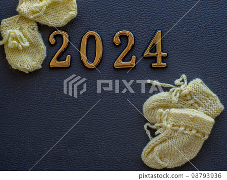 Small baby shoes with 2024 typography 98793936