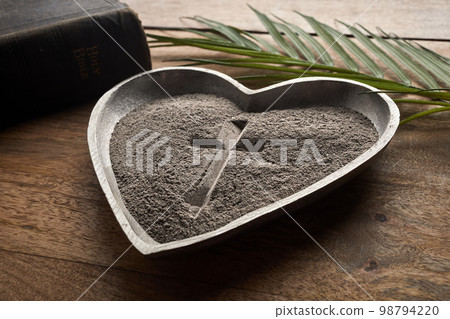 Ash wednesday, crucifix made of ash, dust as christian religion. Lent beginning Ash wednesday, crucifix made of ash, dust as christian religion. Lent beginning 98794220