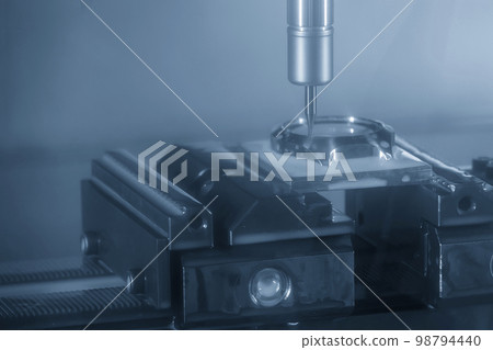 The CNC milling machine cutting watch mold part by solid ball end mill tool. The CNC milling machine cutting watch mold part by solid ball end mill tool. 98794440