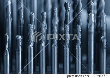 Close-up scene the group of used solid carbide end mill for CNC milling machine. 98794443