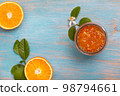 orange jam in a glass jar 98794661