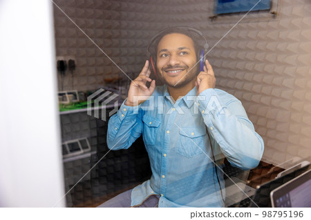 Dark-haired man having hearing checkup at the clinic Dark-haired man having hearing checkup at the clinic 98795196