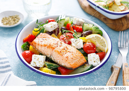 Greek salad with grilled salmon fish. Traditional mediterranean cuisine. Healthy food, diet 98795800