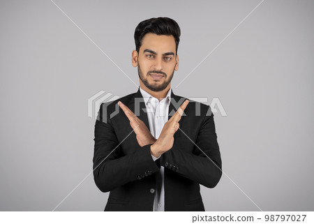 Refusal Concept. Young Arab Businessman Showing Stop Gesture With Crossed Arms 98797027
