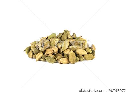 A bunch of seasoning from green cardamom pods on a white background. 98797072