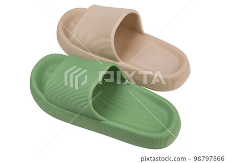 Two slippers for the beach or for the shower, green and beige, on a white background Two slippers for the beach or for the shower, green and beige, on a white background 98797866