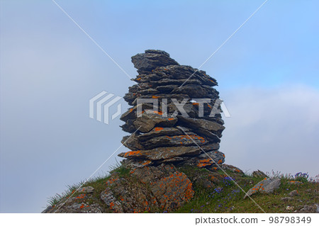 Built from stone Cairn at sunset, at midnight, the polar day Built from stone Cairn at sunset, at midnight, the polar day 98798349