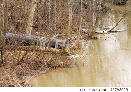 dirty water to the river on industrial from a pipe 98798629