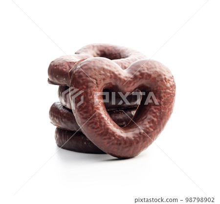 Sweet chocolate hearts isolated on white background. Sweet chocolate hearts isolated on white background. 98798902