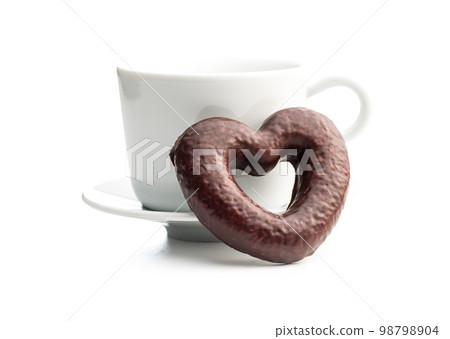Sweet chocolate heart and coffee cup isolated on white background. 98798904