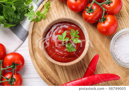 Flat lay composition with tomato sauce on white wooden table Flat lay composition with tomato sauce on white wooden table 98799005