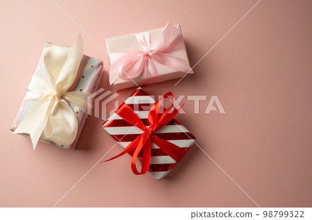 Gift boxes with stripped wrapping paper and red bow, Valentine's Day, Mother's Day 98799322
