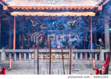 Close up shot of incense burning in the Temple 98801068