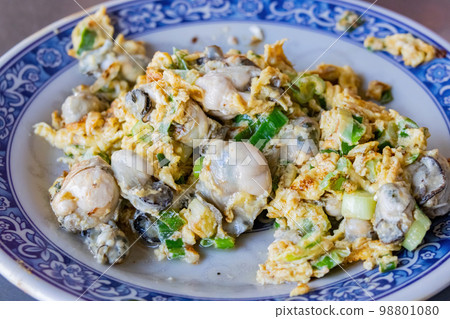 Close up shot of savory fried oyster egg dish Close up shot of savory fried oyster egg dish 98801080