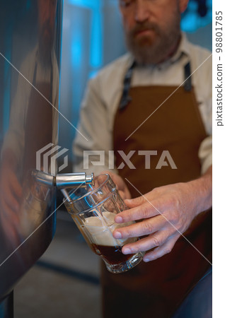 Brewery master quality tasting of craft beer at production facility 98801785