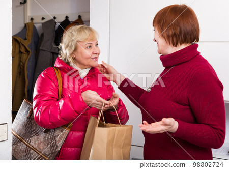 Mature lady visiting her neighbor Mature lady visiting her neighbor 98802724