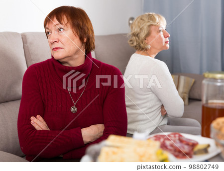 Old women in the hall quarrel 98802749
