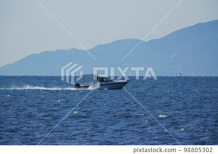 Boat running off Awaji Island in early spring 220212pm 98805302