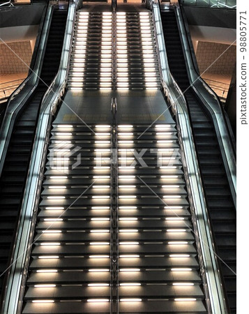 A long, large illuminated staircase and escalator leading from the basement of Kanazawa Station to the first floor A long, large illuminated staircase and escalator leading from the basement of Kanazawa Station to the first floor 98805771