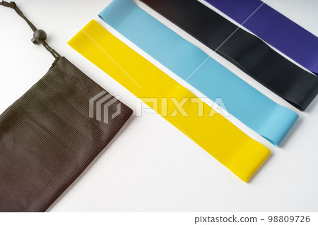 A set of colorful elastic fitness land. Expanders for women A set of colorful elastic fitness land. Expanders for women 98809726
