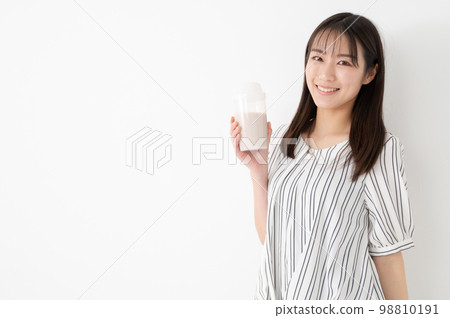 Woman drinking protein milk diet 98810191