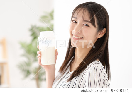 Woman drinking protein milk diet 98810195