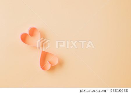 Happy Valentines Day. Above pink ribbon heart shaped decorative symbol isolated on pastel background, love romance concept, template banner design with copy space, Mother, Woman day Happy Valentines Day. Above pink ribbon heart shaped decorative symbol isolated on pastel background, love romance concept, template banner design with copy space, Mother, Woman day 98810688