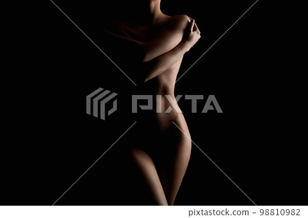 Nude Woman in the Dark. Beautiful Sexy Silhouette Nude Woman in the Dark. Beautiful Sexy Silhouette 98810982